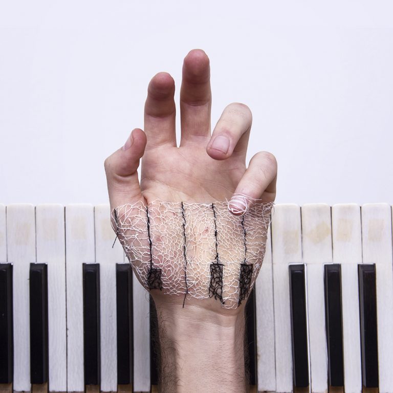 This Artist Stitches the Palm of His Hand to Create Haunting Images This Artist Stitches the Palm of His Hand to Create Haunting Images