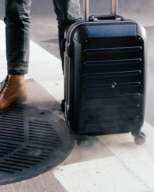This Clever Carry-On Suitcase Has Its Own Retractable Shelving System
