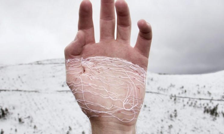 This Artist Stitches the Palm of His Hand to Create Haunting Images