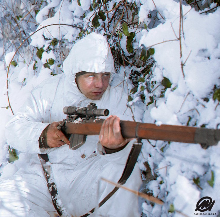 A 1st Royal Ulster Rifles, 6th Airborne Division (UK) Sniper, On Patrol In The Ardennes, Wearing A Snow Camouflage Suit, 14 January 1945.