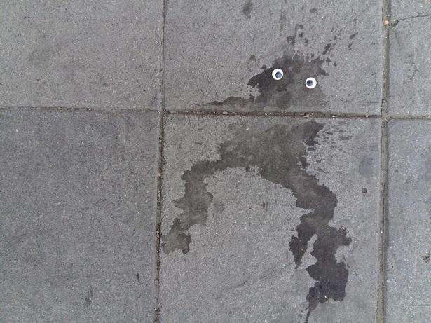 Street stain with googly eyes