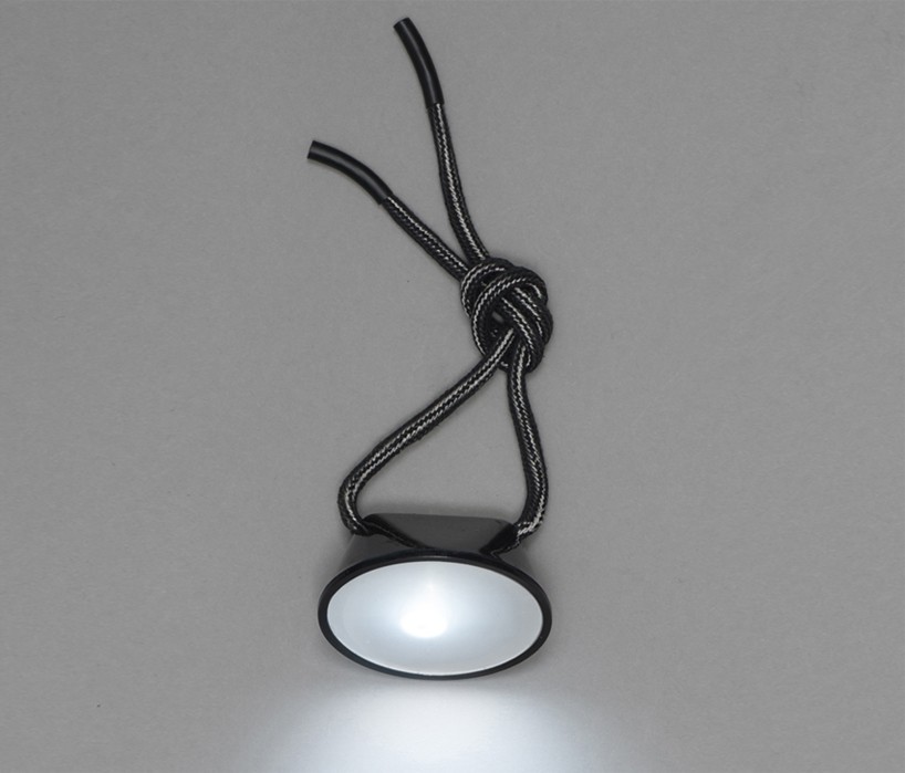 Knot lamp turns on when tied together