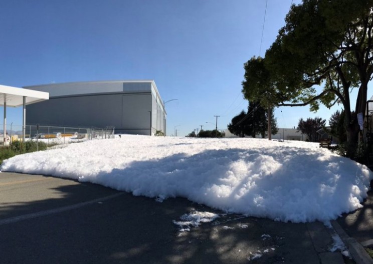 Wall of Foam from Airport Floods into a California Street
