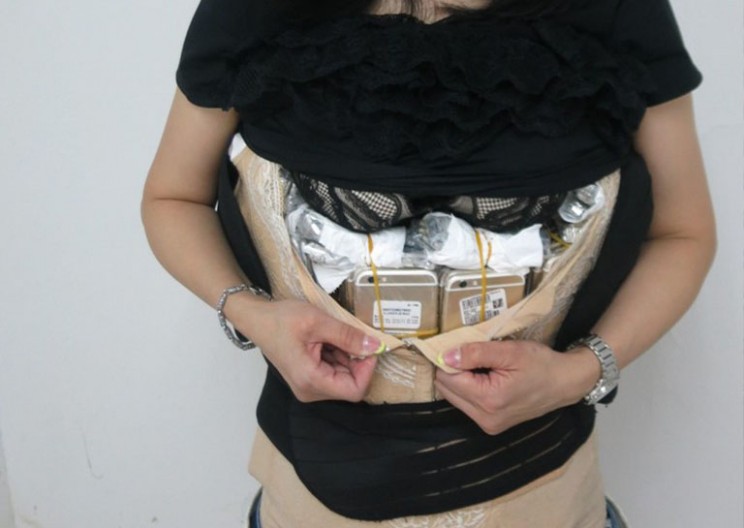 This Chinese Smuggler Got Caught with 102 iPhones Strapped to Her Body