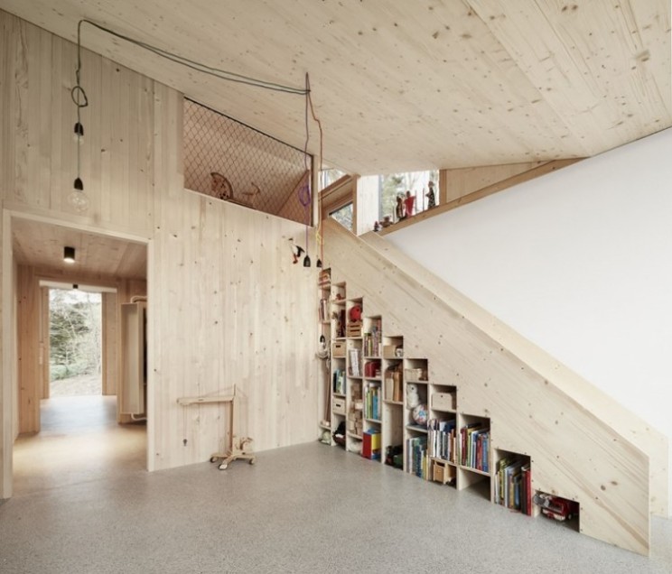 Tiny house has extension built completely around it