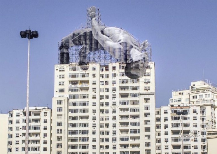 JR Reveals Massive Athletic Sculptures to Open the Olympics