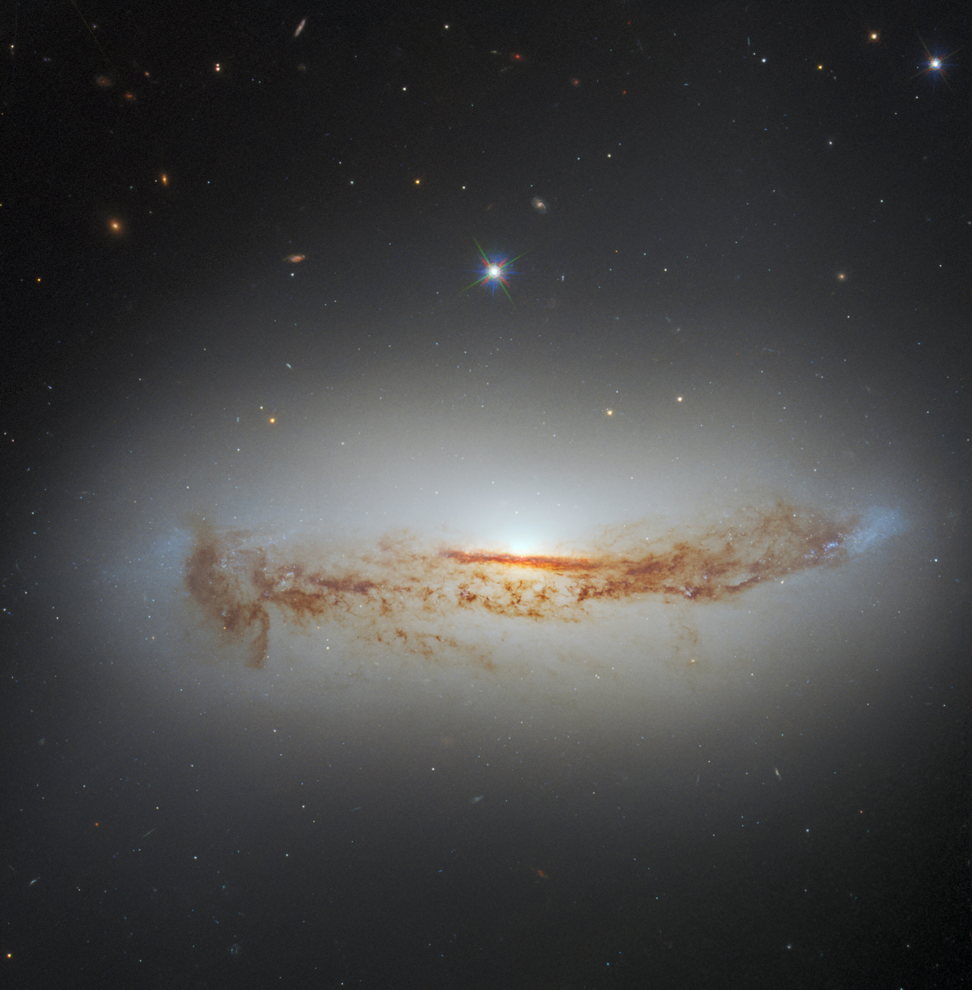 NASA's Hubble spots an active black hole swallowing up giant dust tendrils NASA's Hubble spots an active black hole swallowing up giant dust tendrils