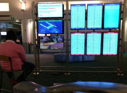 Man Takes over Portland Airport Monitor to Play Video Game Apex Legends