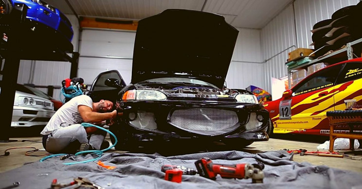 acosta-working-on-cars Acosta Working on Cars