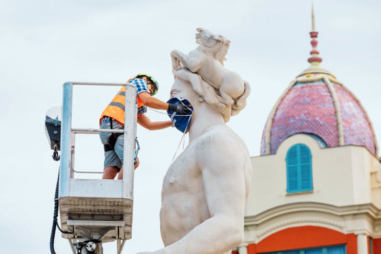 Nice's Apollo sculpture dons a face mask to spread awareness about Covid-19 safety measures Nice's Apollo sculpture dons a face mask