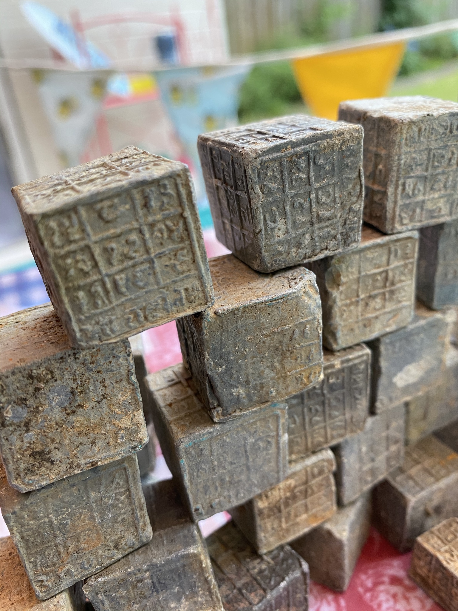 Magnet Fisherman Finds 60 Mysterious Cubes With Inscriptions in Coventry River Magnet Fisherman Finds 60 Mysterious Cubes With Inscriptions in Coventry River