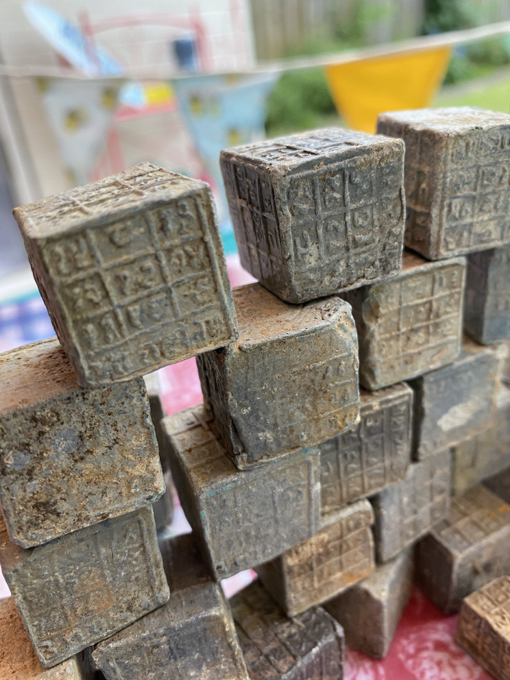 Magnet Fisherman Finds 60 Mysterious Cubes With Inscriptions in Coventry River Magnet Fisherman Finds 60 Mysterious Cubes With Inscriptions in Coventry River