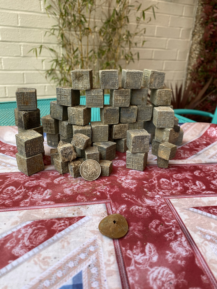 Magnet Fisherman Finds 60 Mysterious Cubes With Inscriptions in Coventry River Magnet Fisherman Finds 60 Mysterious Cubes With Inscriptions in Coventry River