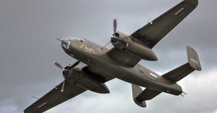 US Navy Ship Carries 14 Vintage WWII Planes to Hawaii