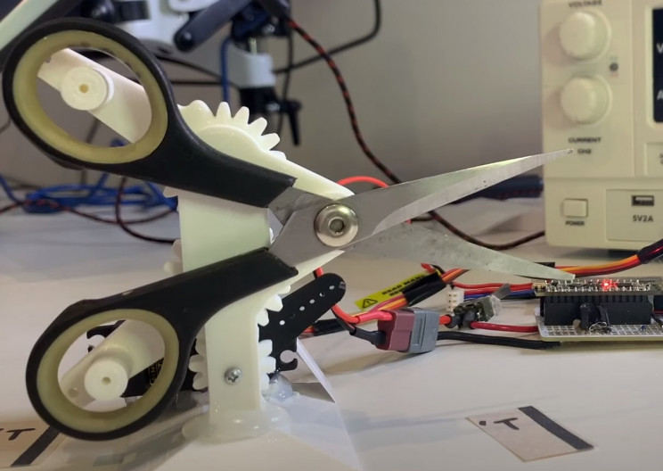 encouragement machine scissors mechanism