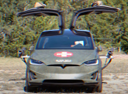 A DIY Mechanic Has Upgraded a Tesla Into a War Machine. With Dual Machine Guns?