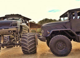 Military Truck and Monster Truck Clash Head to Head in Epic Video