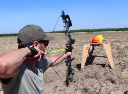Guy Shoots an Arrow to See How Many Hard Hats It Takes to Stop It