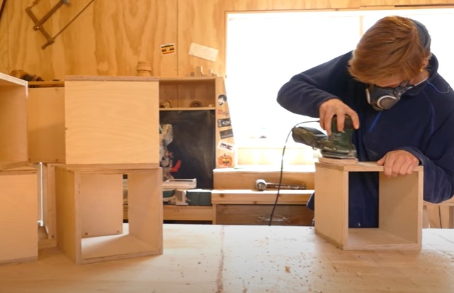diy transforming bookshelf sanding