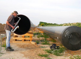 Musician Plays Sax and Duets With an Echo Created by a Natural Gas Pipeline
