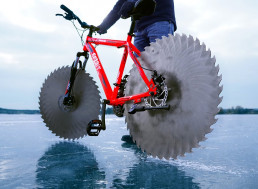 Craftsman Attaches Saws to His Bicycle, Rides it Over a Frozen Lake
