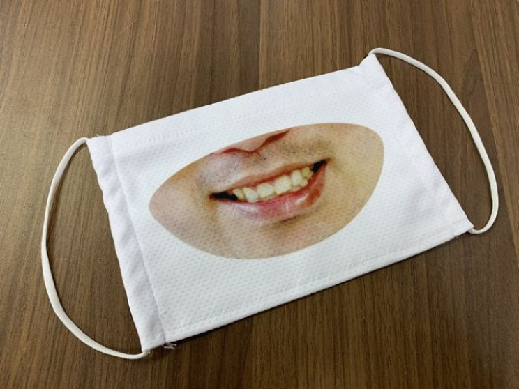 Japanese Shop Staff Wears Smiling Masks to Look Friendly Japanese Shop Staff Wears Smiling Masks to Look Friendly