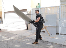 Watch This Guy Use an Exoskeleton to Lift a 50 Pound Sword