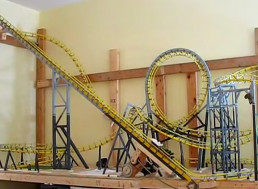 Hobbyist Tries Out 13-Car Train on Mini Roller Coaster