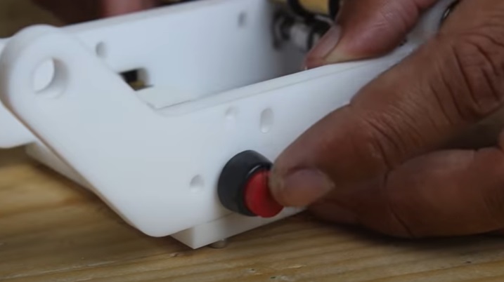 motorized notepad button