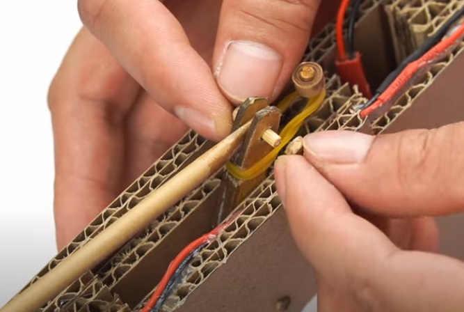 diy cardboard gun firing rod